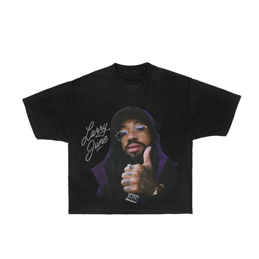 Image description: A graphic tee featuring Larry June, capturing the essence of the hip-hop icon's unique style. This comfortable Larry June graphic tee is a straightforward yet stylish choice for fans looking to showcase their appreciation for Larry June's distinctive presence in the music scene.